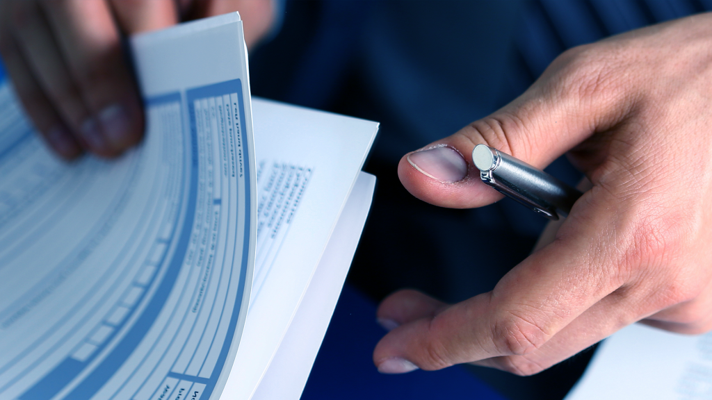 a ny life inusrance agent pulling out papers